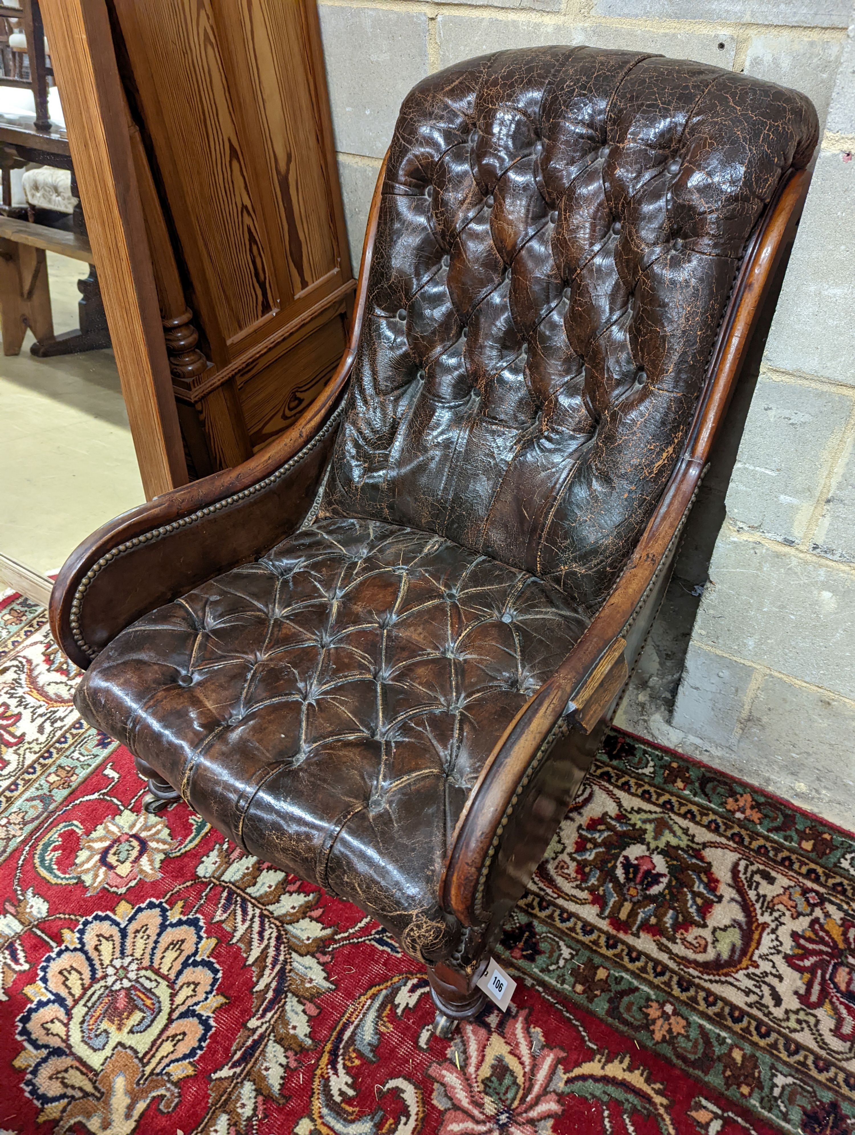 A late 19th century leather button back chair. H-90cm.